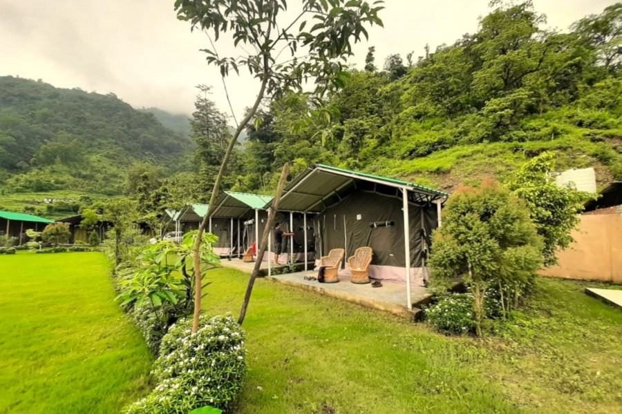 Exterior view of camps nestled within natural surroundings.