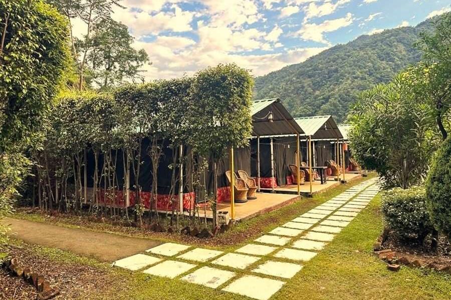 Exterior view of a camp majestic surrounded by natural scenery.